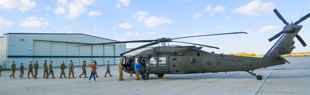 ROTC Cadets loading a Blackhawk