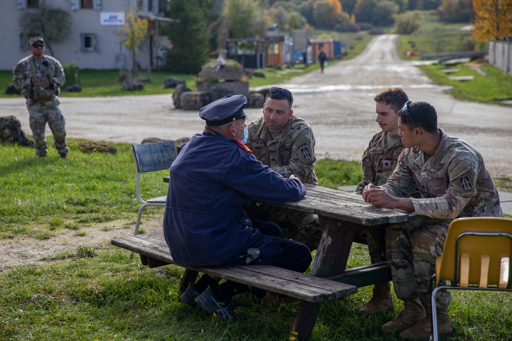 Liaison Monitoring Teams meet with actors for training exercise
