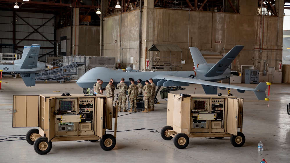 Service members assigned to the 435th Contingency Response Squadron, Ramstein AB in Germany complete MQ-9 training with fellow Airmen from the 163D Maintenance Squadron on March ARB.