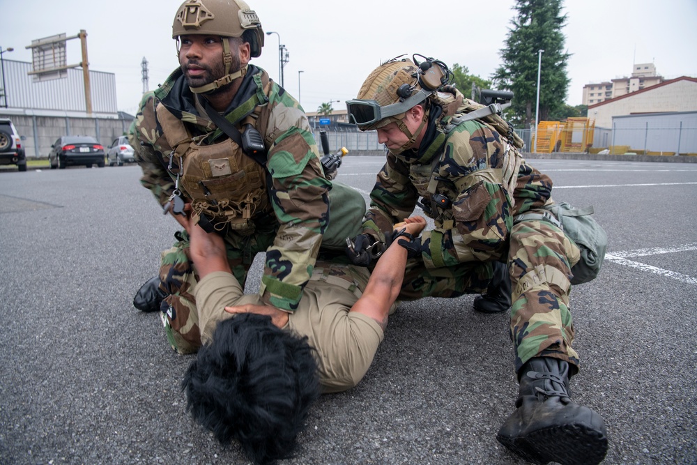 The 374th SFS conducts protest control exercise during SRI