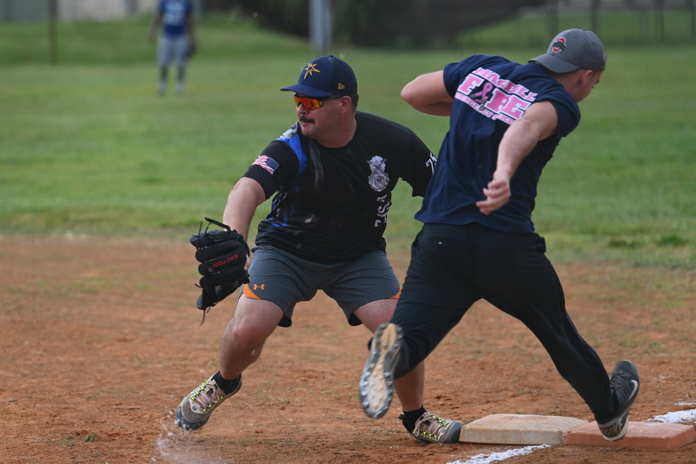 6th CES competes against 6th SFS in softball during Fire Prevention Week