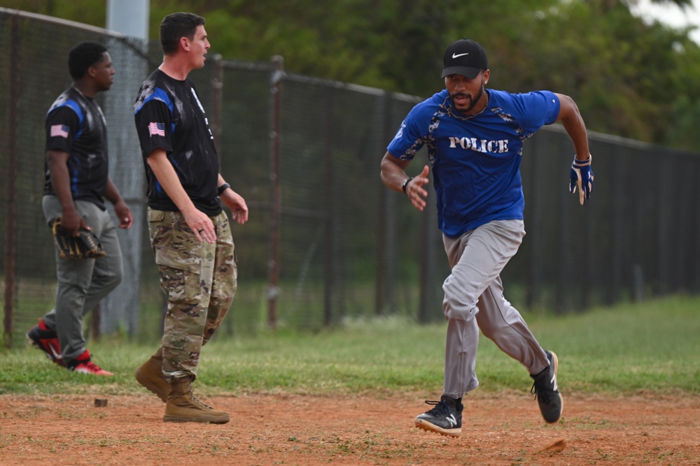 6th CES competes against 6th SFS in softball during Fire Prevention Week