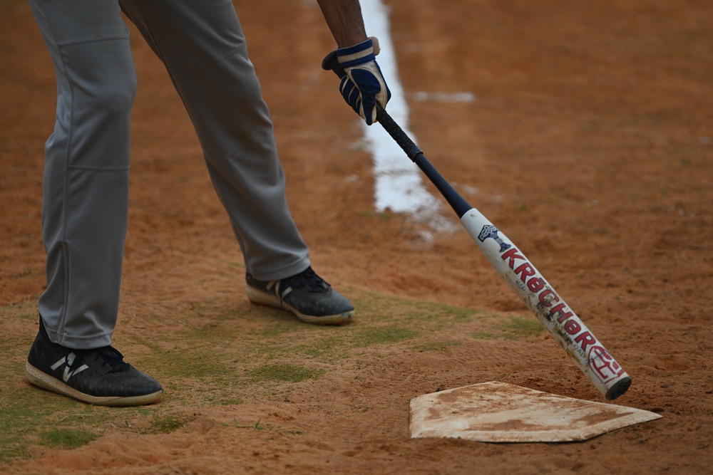 6th CES competes against 6th SFS in softball during Fire Prevention Week