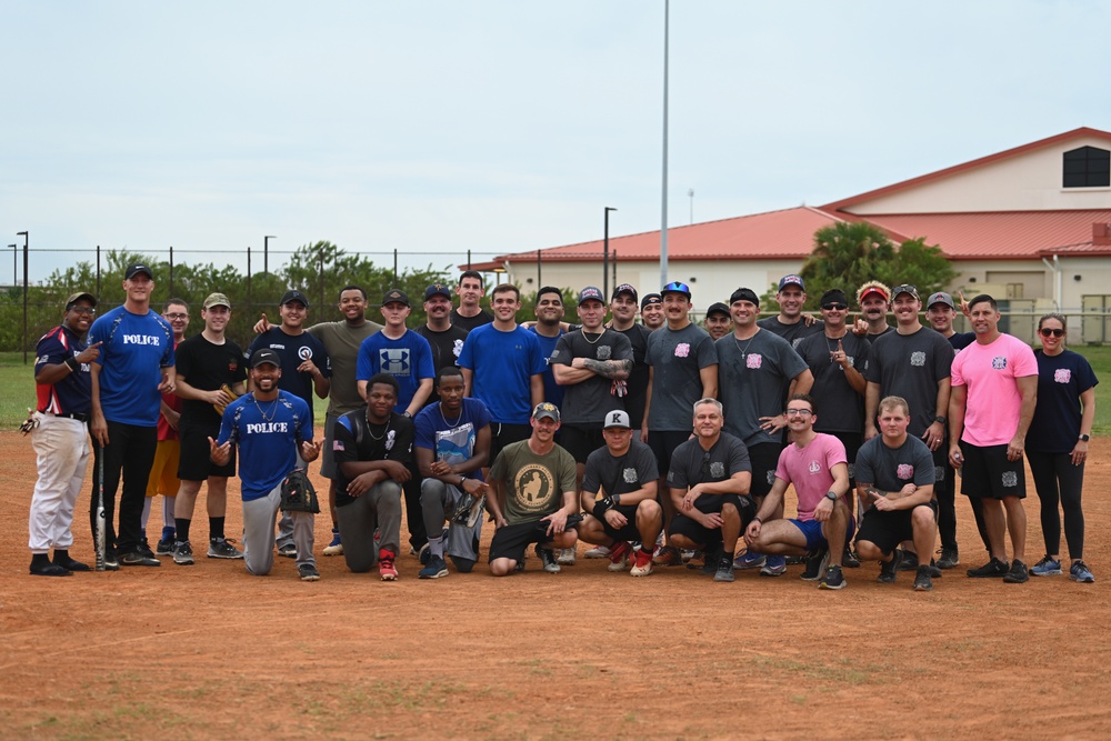 6th CES competes against 6th SFS in softball during Fire Prevention Week