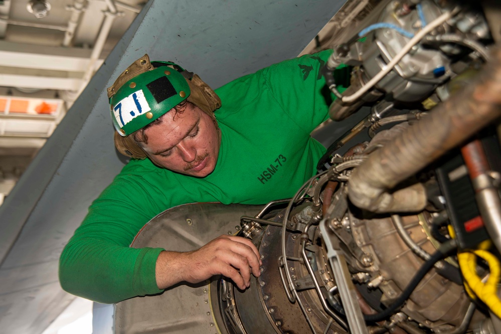 U.S. Navy Sailor Conducts Maintenance