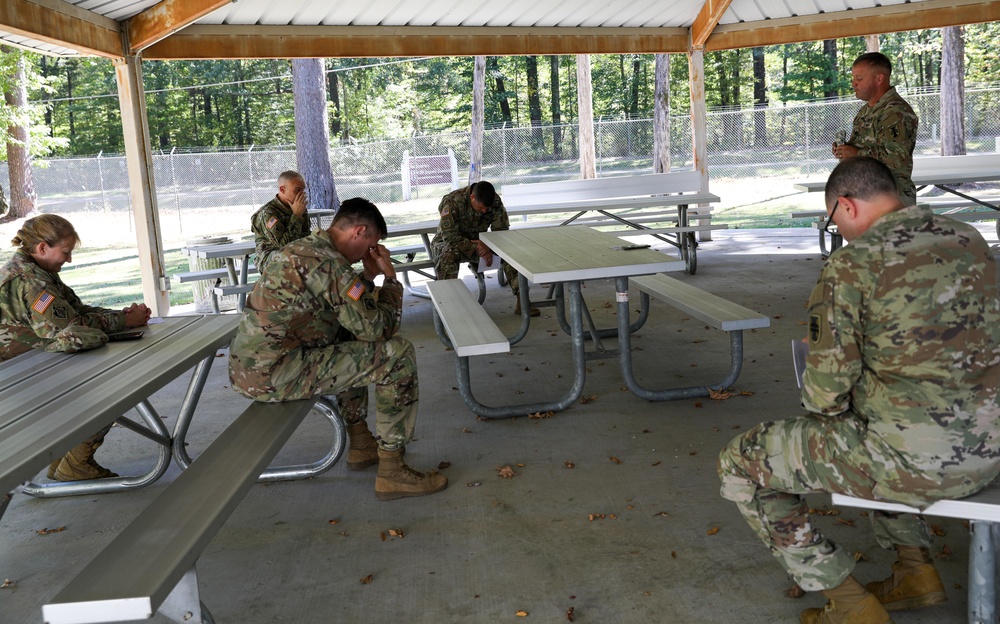 412th TEC Soldiers pray during Religious Services