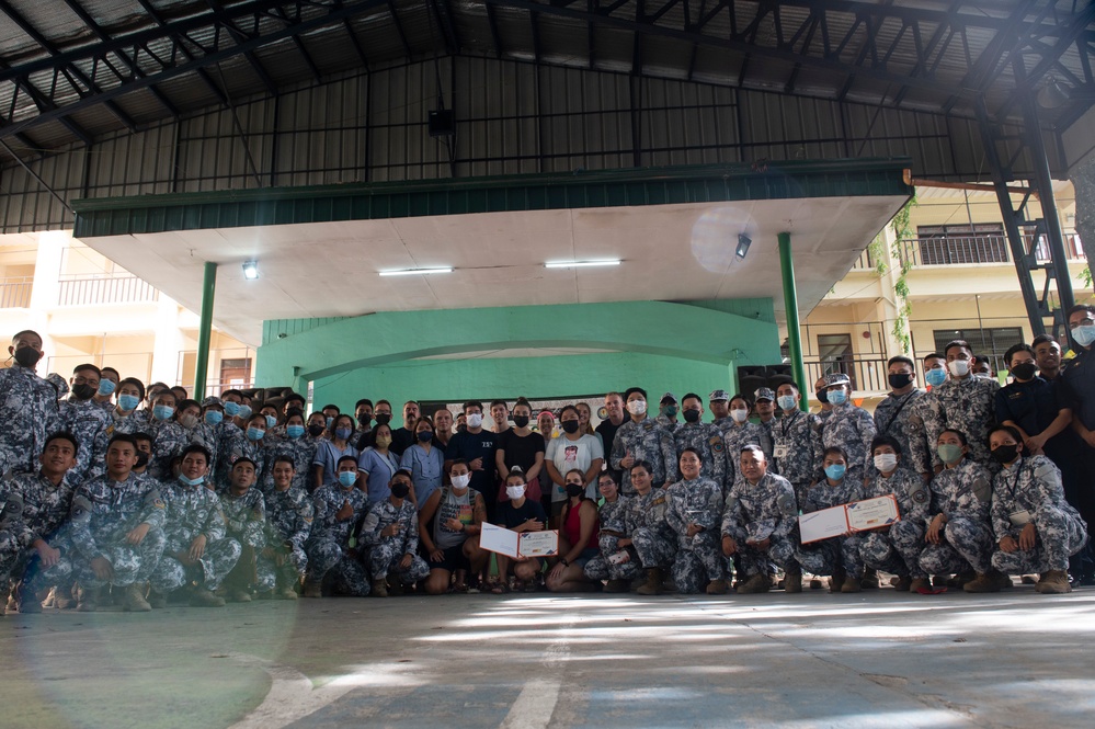 In the Spirit of Giving: U.S., Philippine Coast Guard volunteer at local Manila elementary school