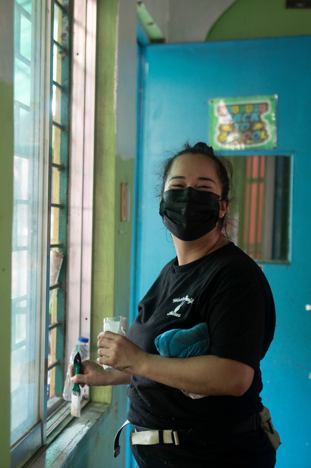 In the Spirit of Giving: U.S., Philippine Coast Guard volunteer at local Manila elementary school