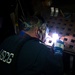 Coast Guard Cutter Hamilton crewmember welds while underway in the Atlantic Ocean