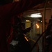 Coast Guard Cutter Hamliton crewmembers repair refrigerator while underway in the Atlantic Ocean