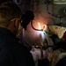 Coast Guard Cutter Hamliton crewmembers repair refrigerator while underway in the Atlantic Ocean