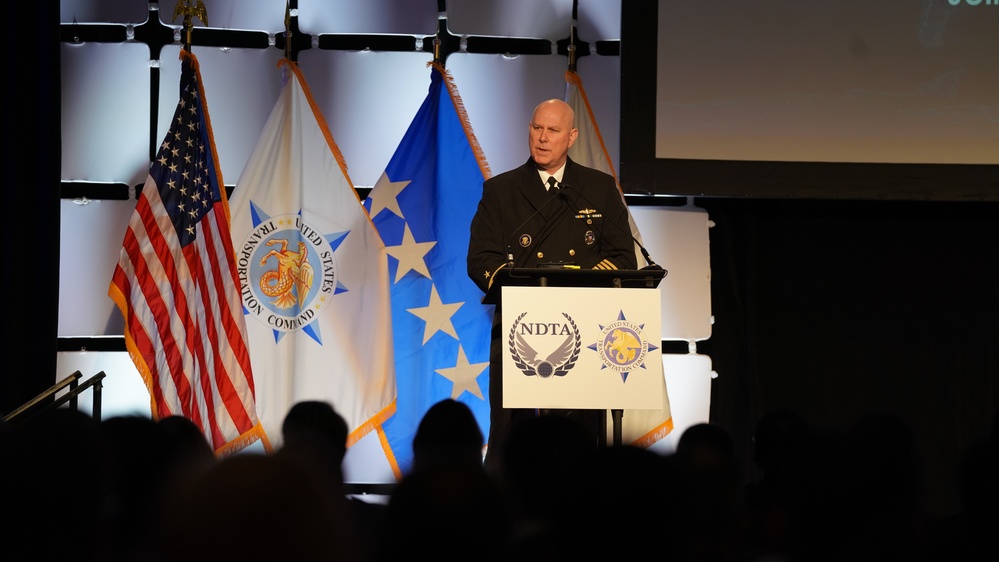 Admiral Christopher Grady speaks to attendees at the 2022 National Defense Transportation Association – U.S. Transportation Command Fall Meeting