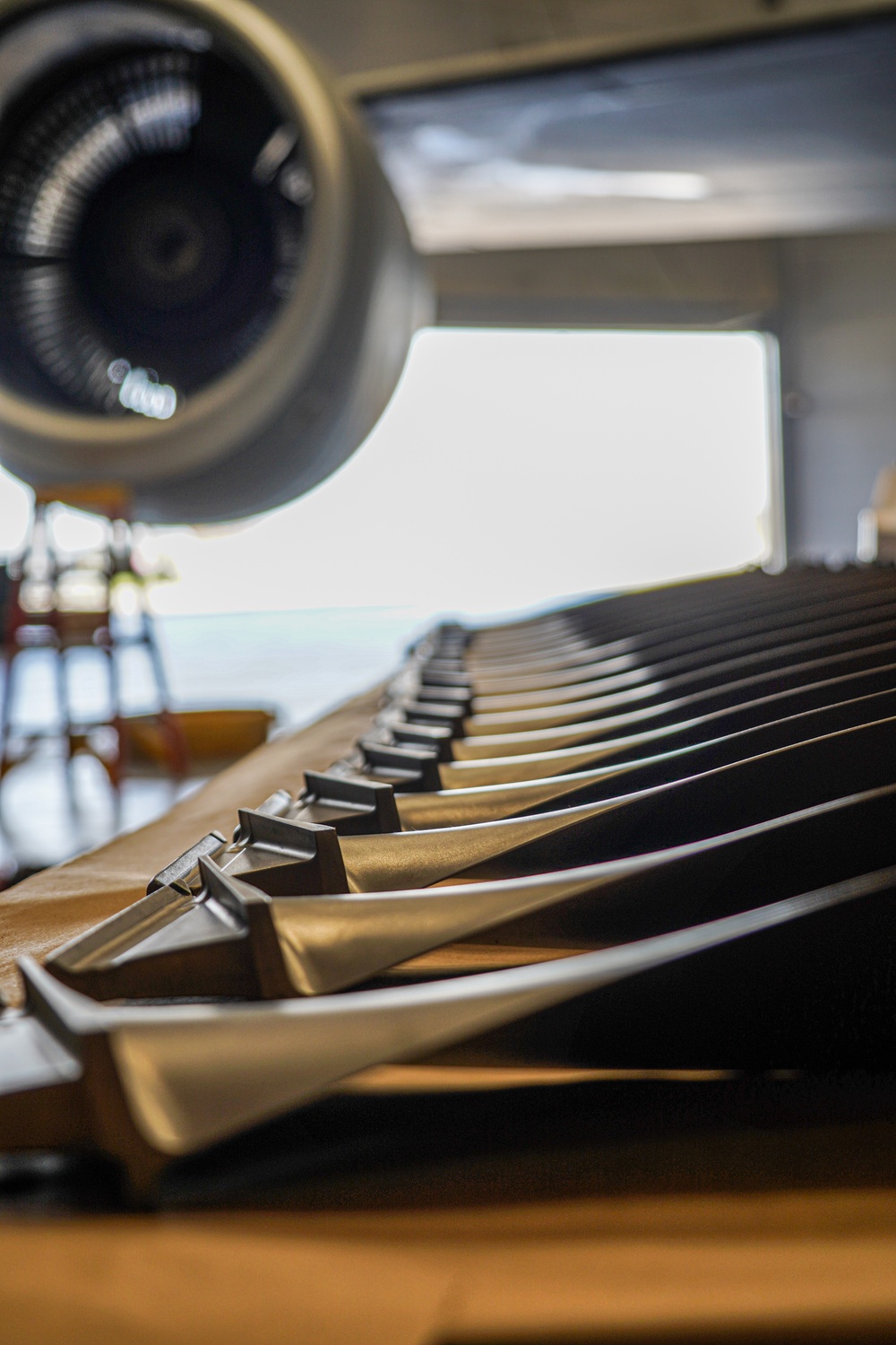 KC-135 fan blades lined up on table