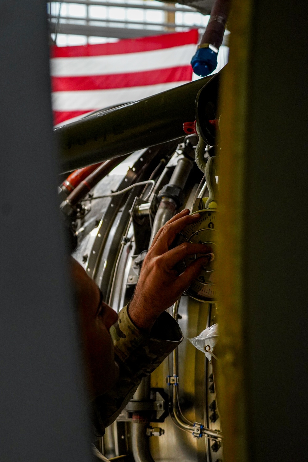 Aircraft maintainer inspects engine weight scale