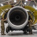 KC-135 engine being lifted into place