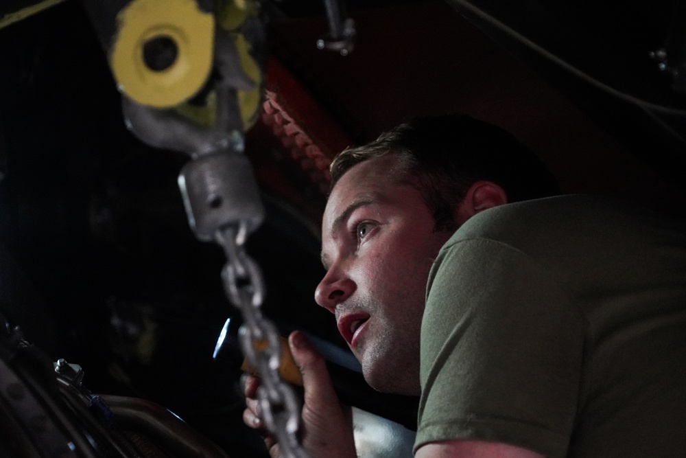 Aircraft maintainer inspects KC-135 engine