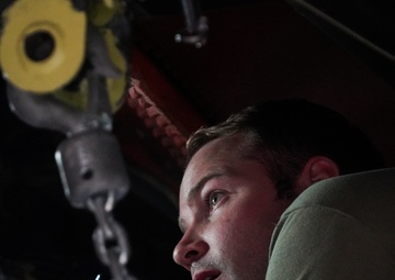 Aircraft maintainer inspects KC-135 engine