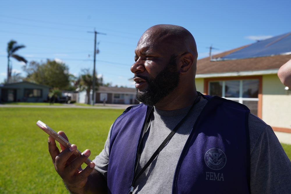FEMA Disaster Survivor Assistance Team Member Speaks with Survivor on the Phone