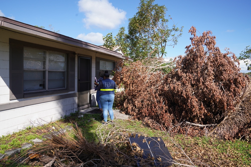 A FEMA Disaster Survivor Assistance Team Visits a Home with Significant Damage