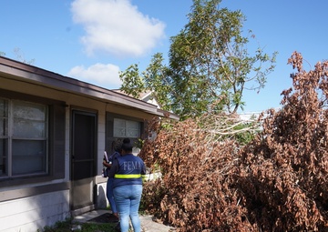 A FEMA Disaster Survivor Assistance Team Visits a Home with Significant Damage