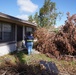 A FEMA Disaster Survivor Assistance Team Visits a Home with Significant Damage