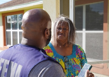 FEMA Disaster Survivor Assistance Team Speak to Survivor with Roof Damage