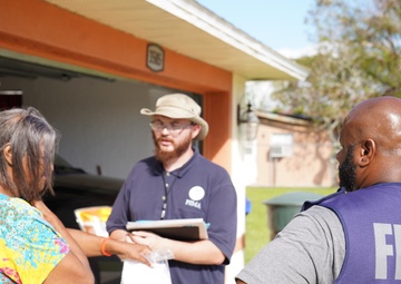 FEMA Disaster Survivor Assistance Team Speak to Survivor with Roof Damage