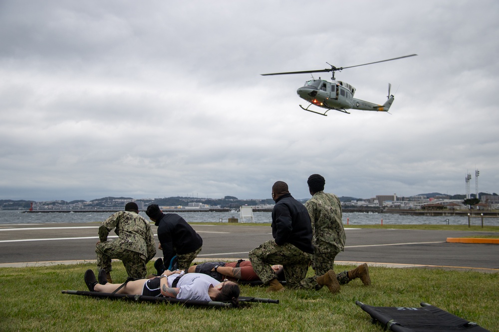 USNMRTC Yokosuka and Yokota Air Base Staff Education and Training (SEAT) partner to perform UH-1N helicopter mass casualty drill components