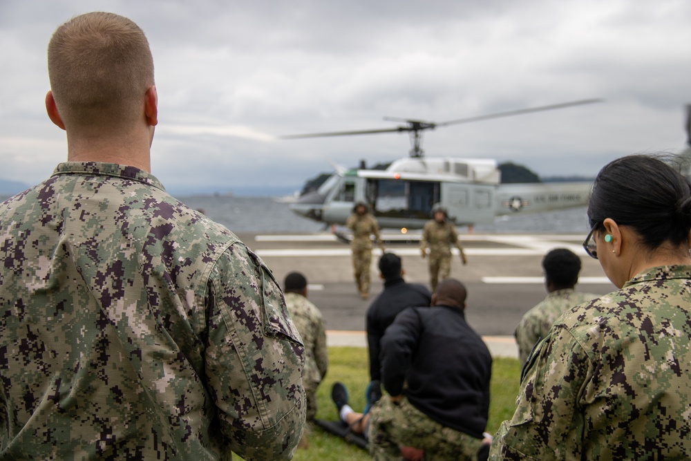 USNMRTC Yokosuka and Yokota Air Base Staff Education and Training (SEAT) partner to perform UH-1N helicopter mass casualty drill components