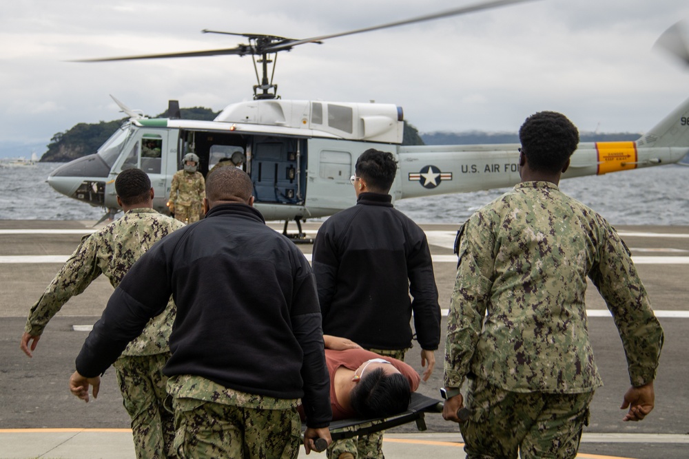 USNMRTC Yokosuka and Yokota Air Base Staff Education and Training (SEAT) partner to perform UH-1N helicopter mass casualty drill components