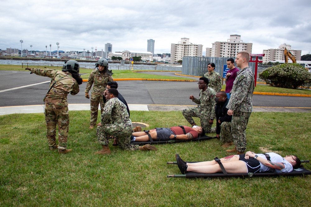 USNMRTC Yokosuka and Yokota Air Base Staff Education and Training (SEAT) partner to perform UH-1N helicopter mass casualty drill components