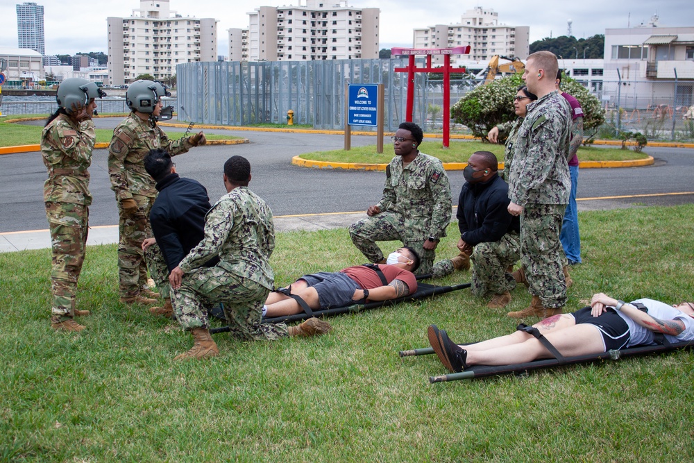 USNMRTC Yokosuka and Yokota Air Base Staff Education and Training (SEAT) partner to perform UH-1N helicopter mass casualty drill components