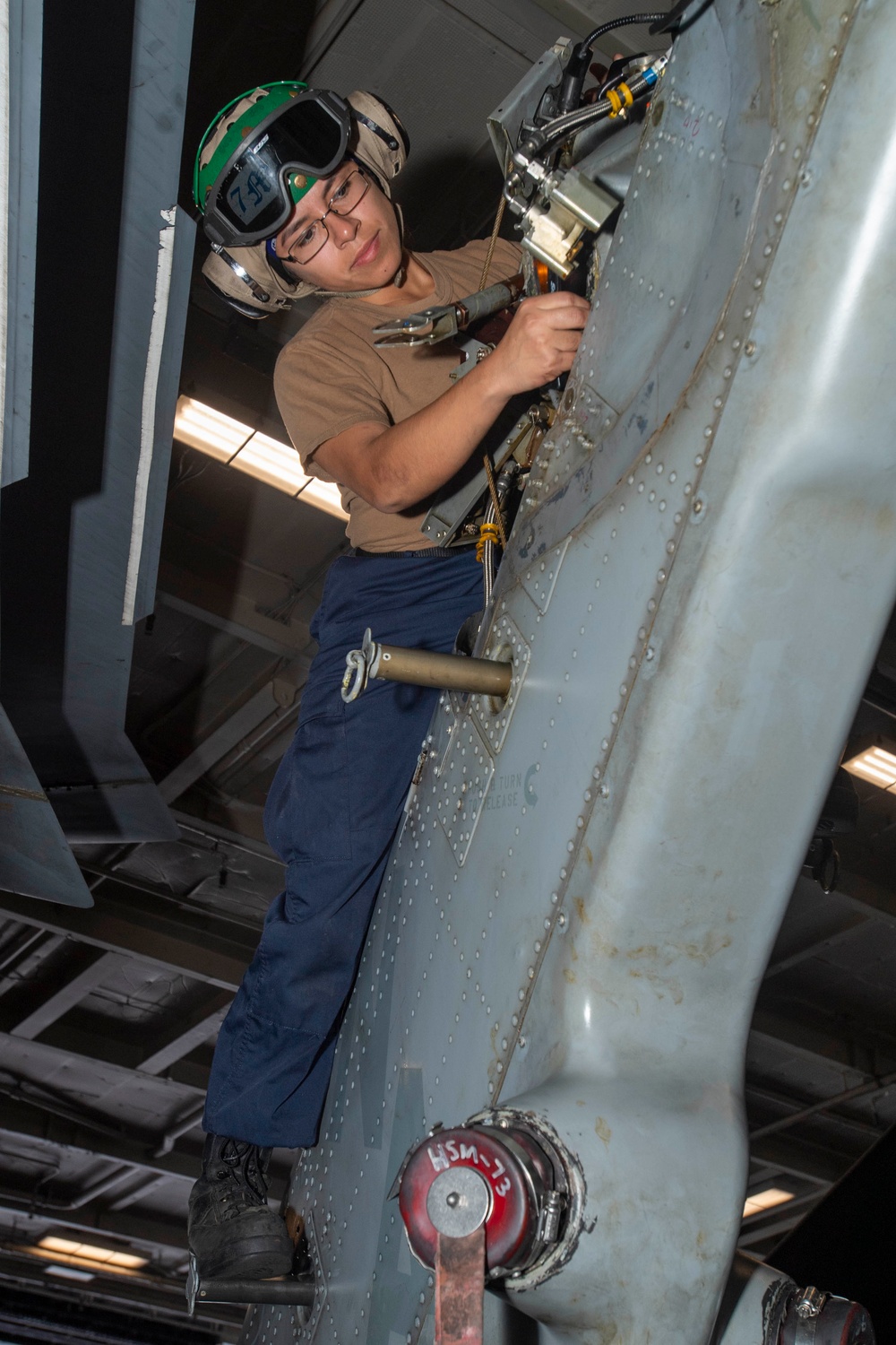 Sailor Cleans Tail Rotor Mounting Surface