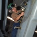 Sailor Cleans Tail Rotor Mounting Surface