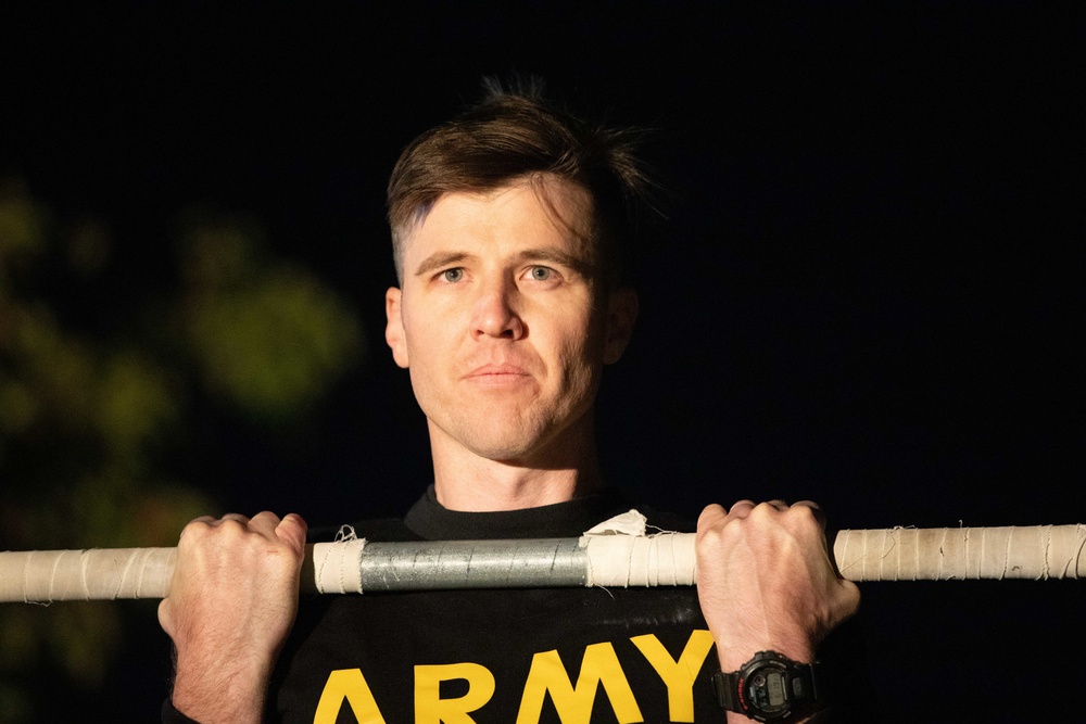 Soldier performs the flexed-arm hang event of the GAFPB