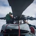 U.S. Sailors Conduct Routine Maintenance On An MH-60R Sea Hawk Helicopter