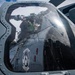 U.S. Sailor Performs Maintenance On An MH-60R Sea Hawk Helicopter