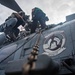 U.S. Sailors Perform Maintenance On An MH-60R Sea Hawk Helicopter