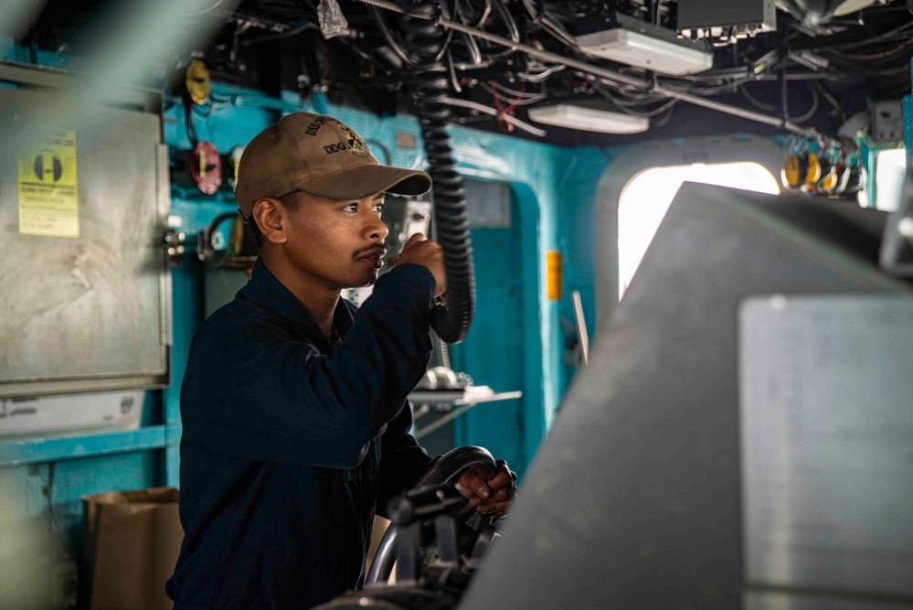 U.S. Navy Sailor Mans The Helm