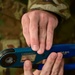 Photo of U.S. Air Force Tech. Sgt. Kurt Stuckart performing an annual inventory and inspection on a pin removal and insertion kit