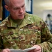 Photo of U.S. Air Force Tech. Sgt. Kurt Stuckart performing an annual inventory and inspection on a pin removal and insertion kit