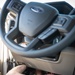 Photo of U.S. Air Force Tech. Sgt. Michael Moody installing a vehicle analytics device