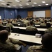 Packed room of NCOs