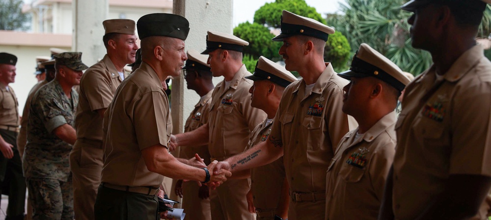 Cheif Construction Mechanic Michael Cornett being congratulated after the Cheif Petty Officer Pinning Ceremony.