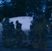 U.S. Marines conduct night time operations in Mission Oriented Protective Posture (MOPP) gear