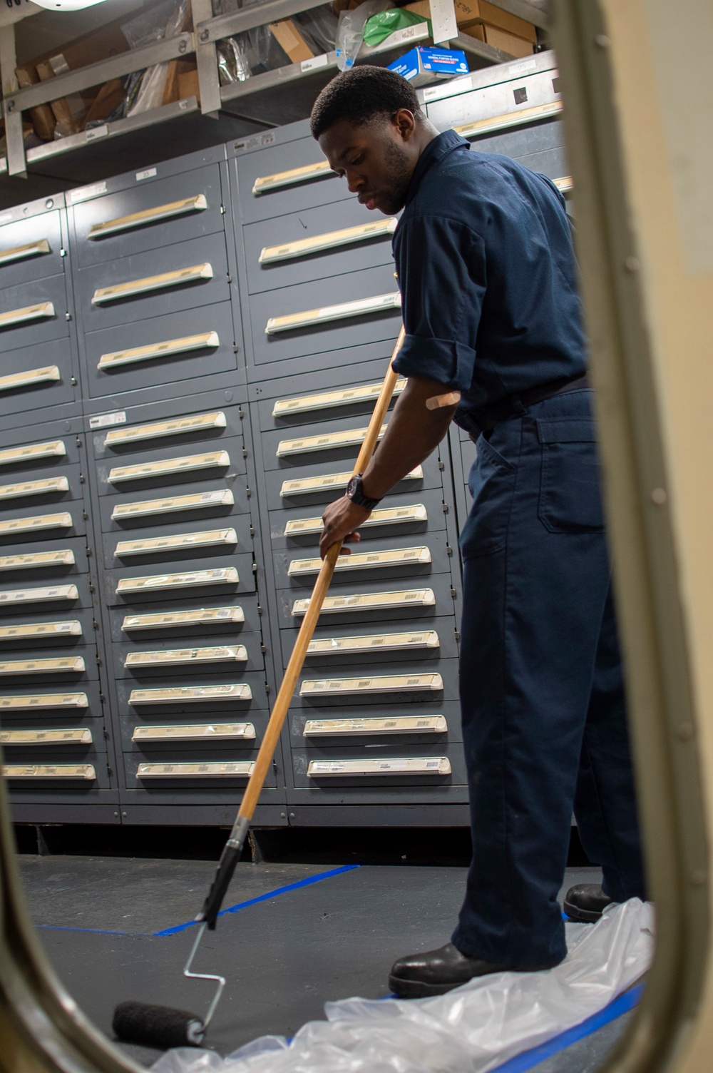 U.S. Navy Sailor Paints The Deck