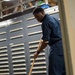 U.S. Navy Sailor Paints The Deck