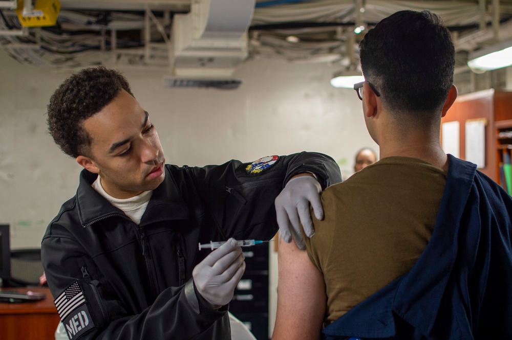 U.S. Navy Sailor Administers Vaccines