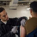 U.S. Navy Sailor Administers Vaccines