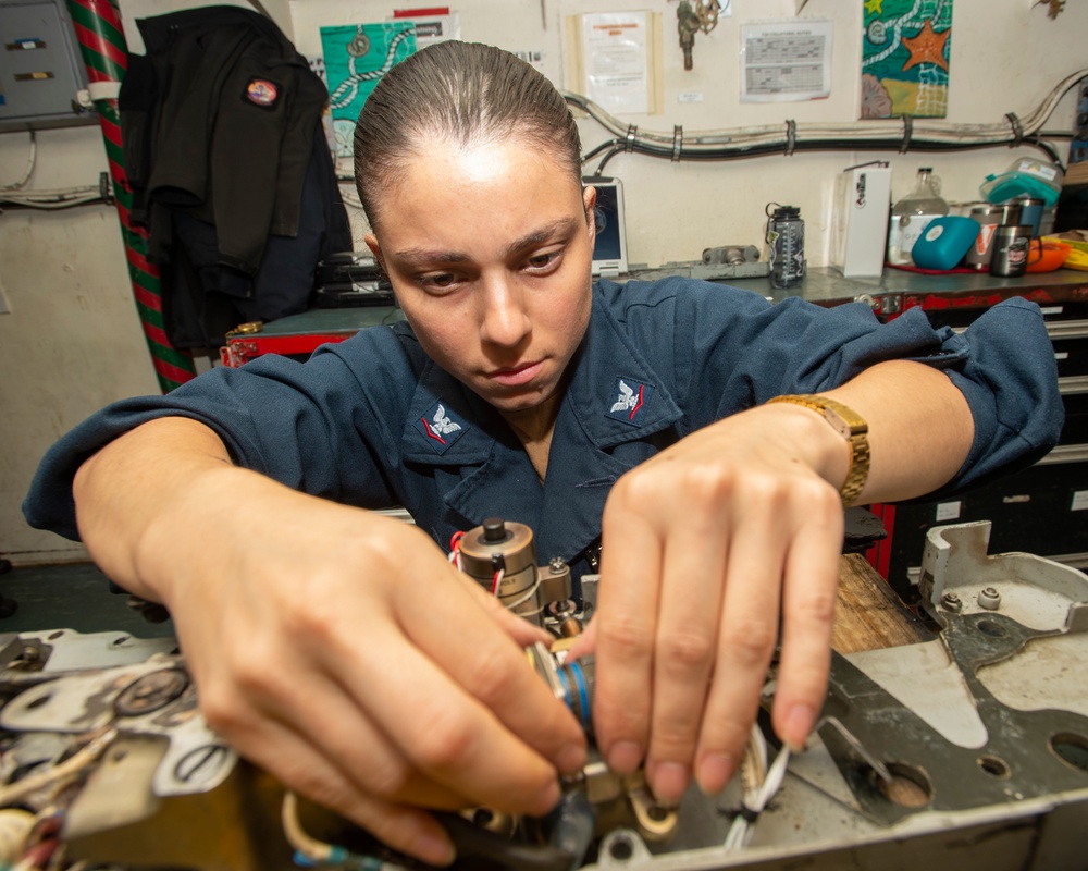 Sailor Installs Actuator In Bomb Rack